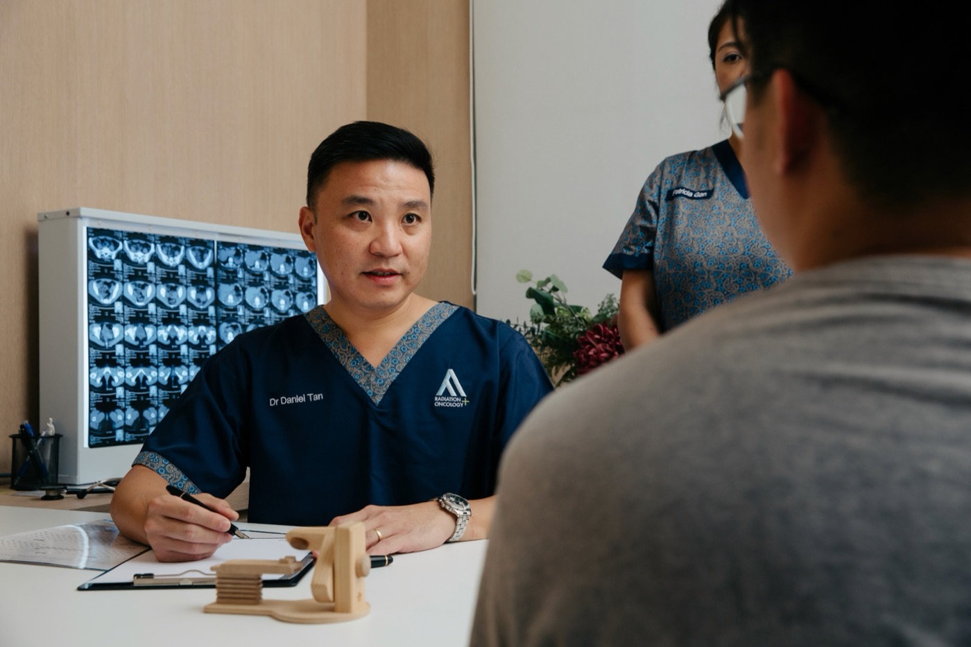 Oncologist reviewing a liver CT scan
